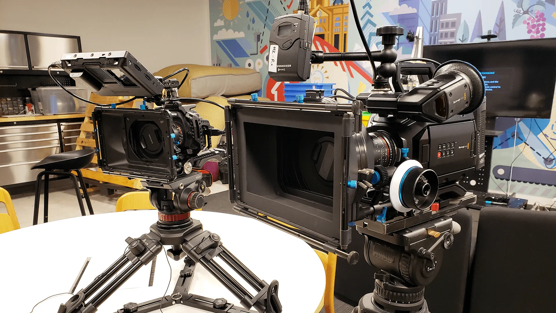 Two video camera systems, viewed slightly from the side